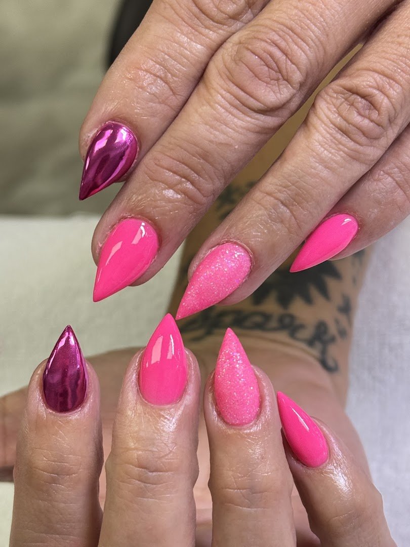 Manicured nails displayed in a salon setting.